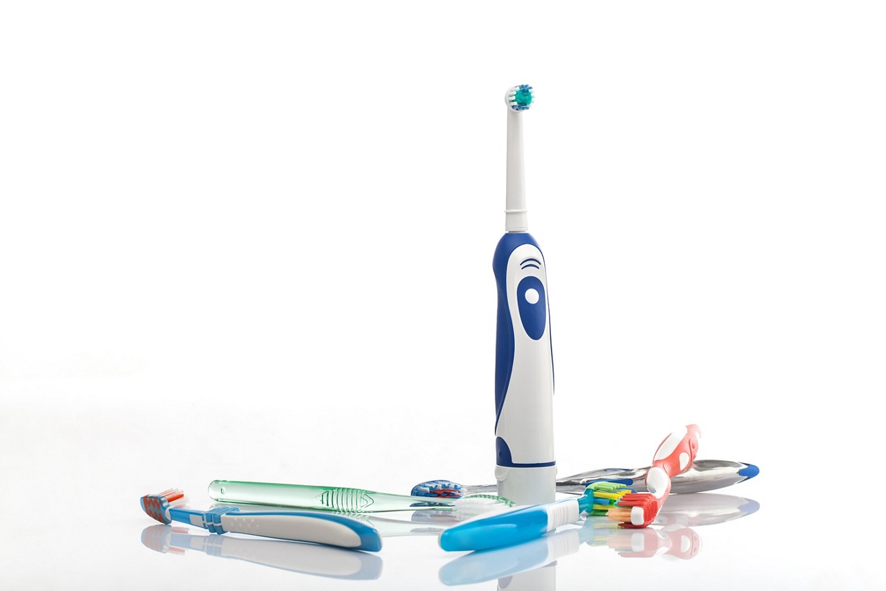 toothbrushes on white with reflection