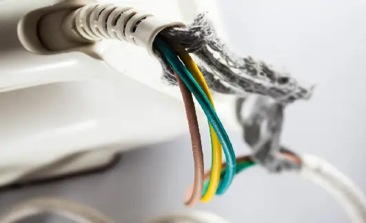 Close-up of electrical wires in insulation - exploring plastics corrosion prevention and flammability risk in cables.